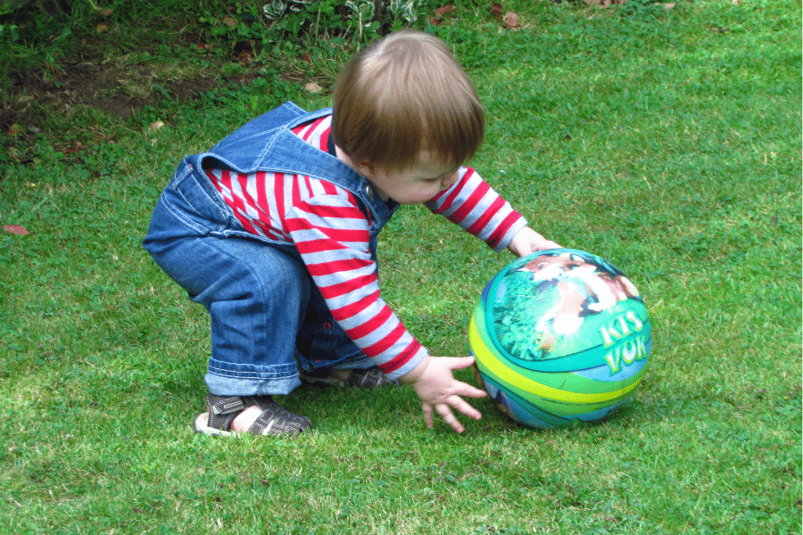 toddler playing ball outside - easy outdoor activities