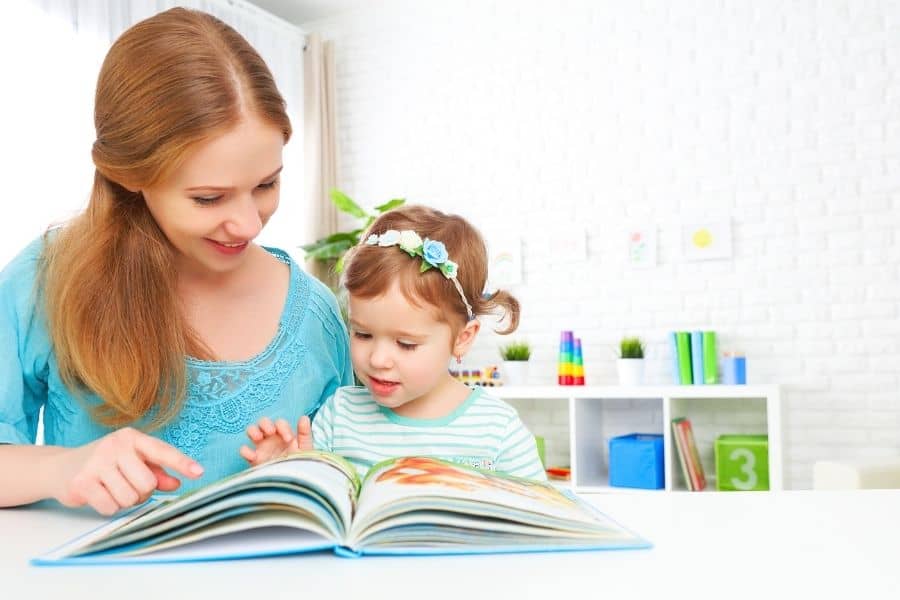 mom and child reading board books together